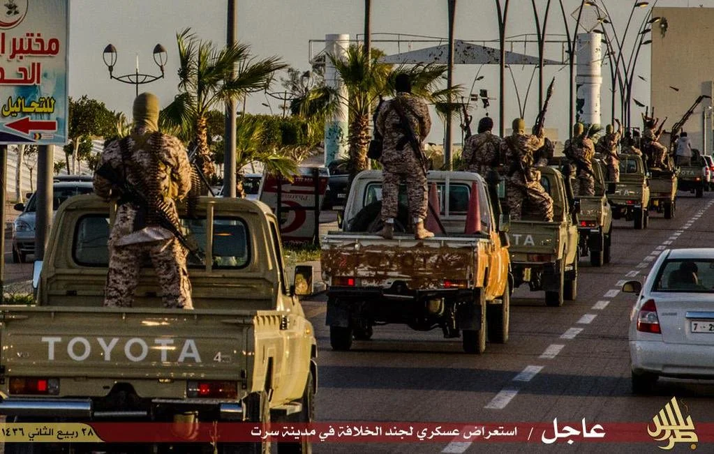 Armed militia on Toyota cars