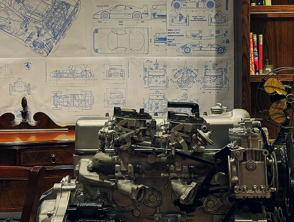 A large engine sitting on top of a wooden table